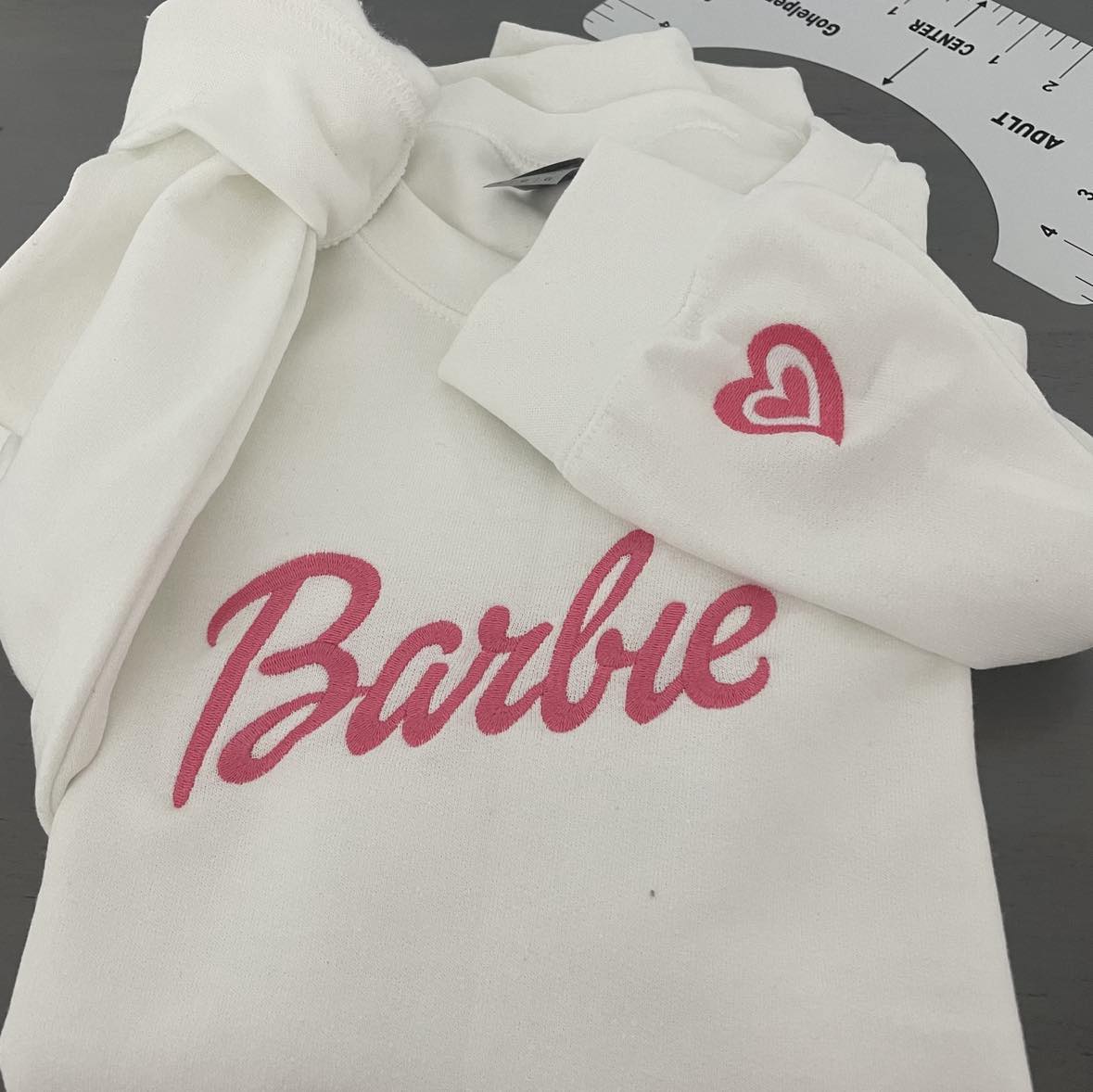 Barbie embroidered sweatshirt with a heart embroidered on the cuff