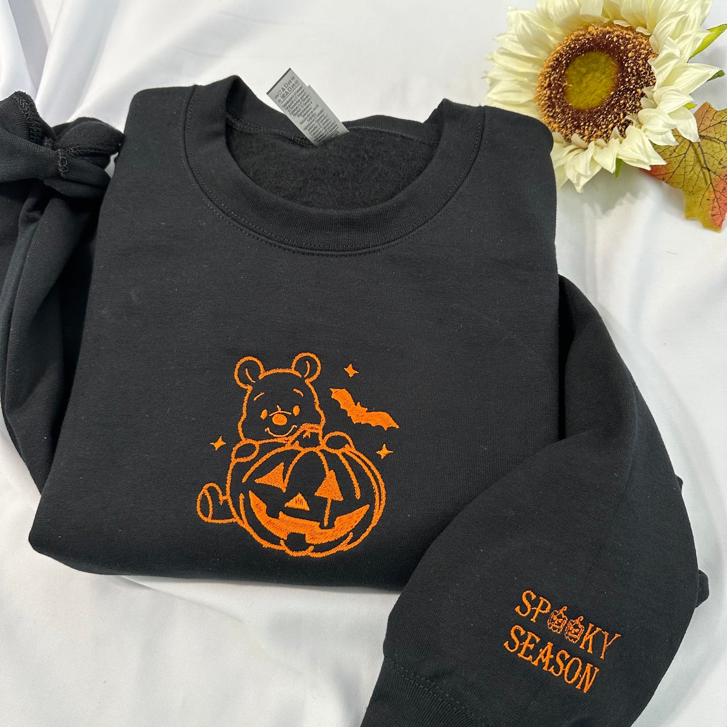 Halloween Winnie the Pooh embroidered sweatshirt with a spooky season embroidered on the cuff; Halloween Pumpkin embroidered sweatshirt