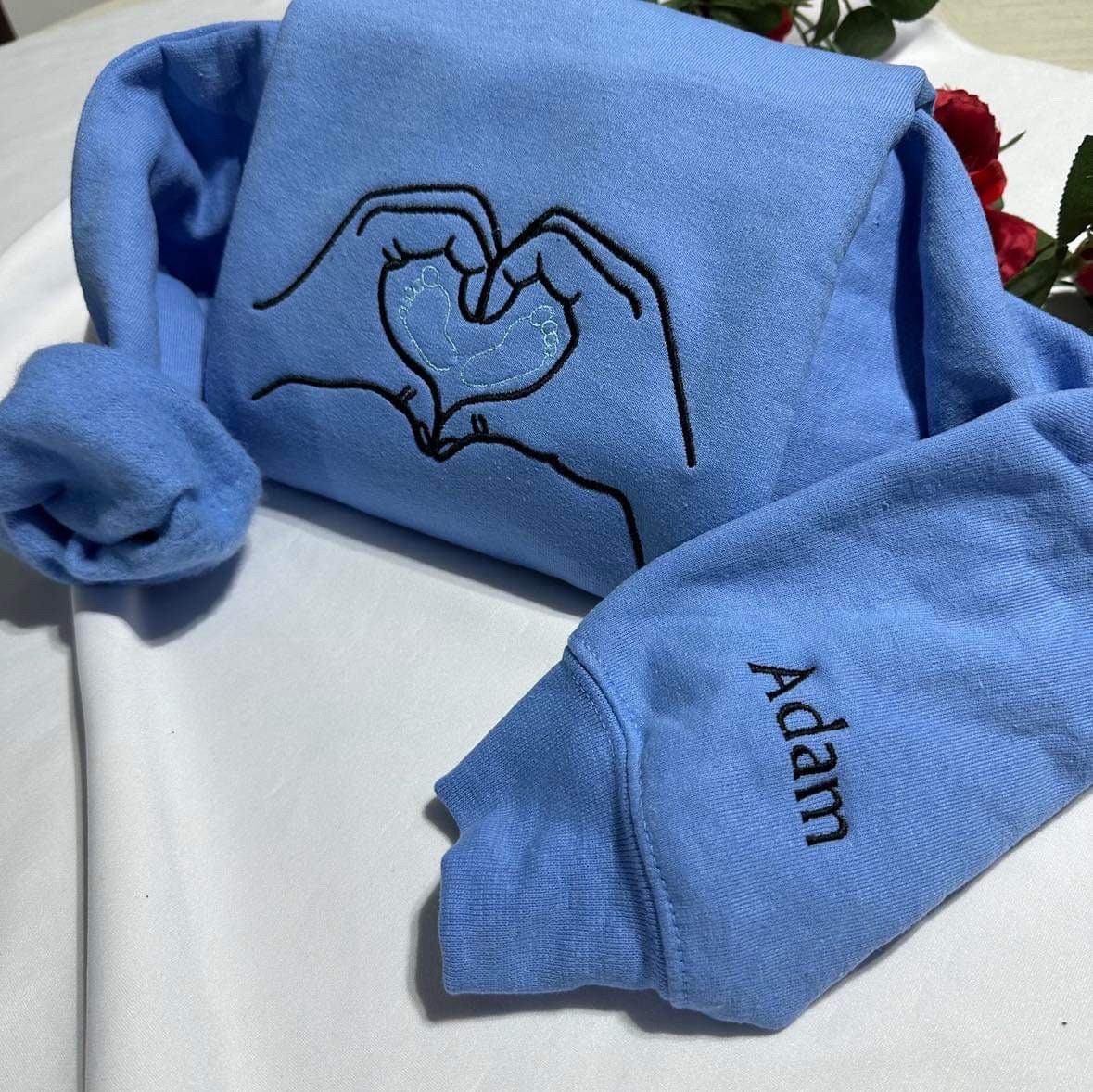 Custom embroidered sweatshirt; Mother hands with baby feet custom embroidery, Custom baby’s name gift. Mothers Day Personalised gift