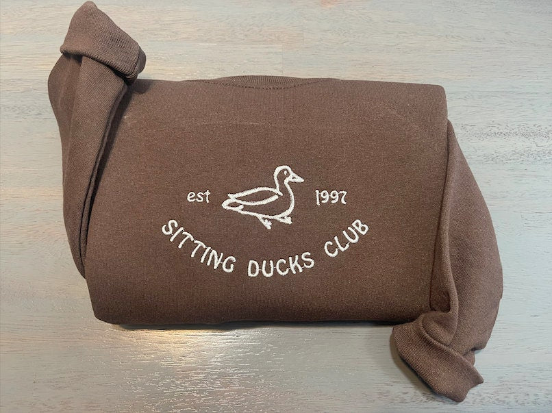 Sitting Ducks Embroidered Sweatshirts; Ducks Embroidered crewneck; Sitting Ducks Club embroidered Sweaters - MrEmbroideryGifts